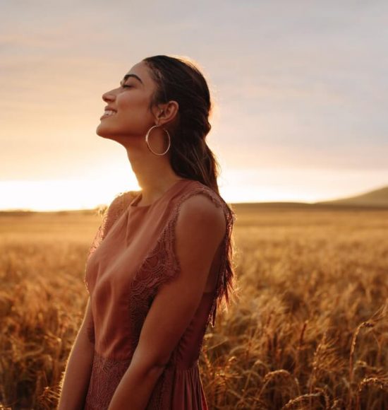 Happy woman enjoying in the nature