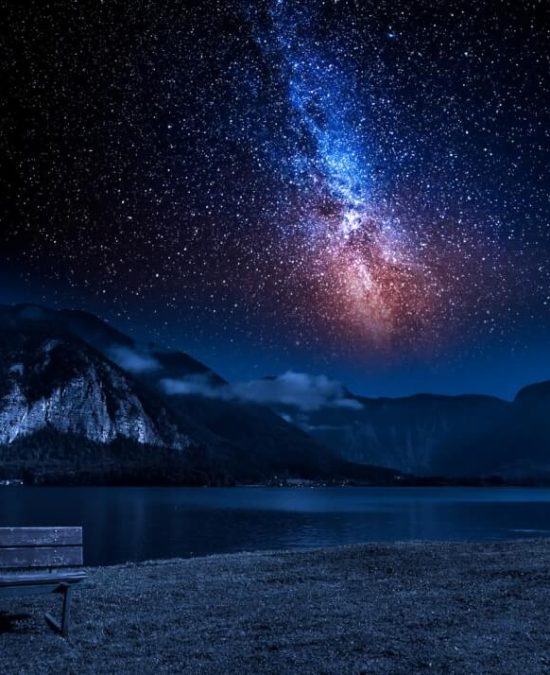 Mountain and lake at night with stars